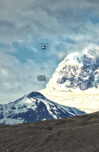 The helicopter-borne radar antenna system flying over Lago Argentino