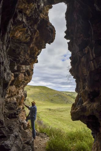 GunaiKurnai Elder Uncle Russell Mullett at the cave entrance of Cloggs Cave