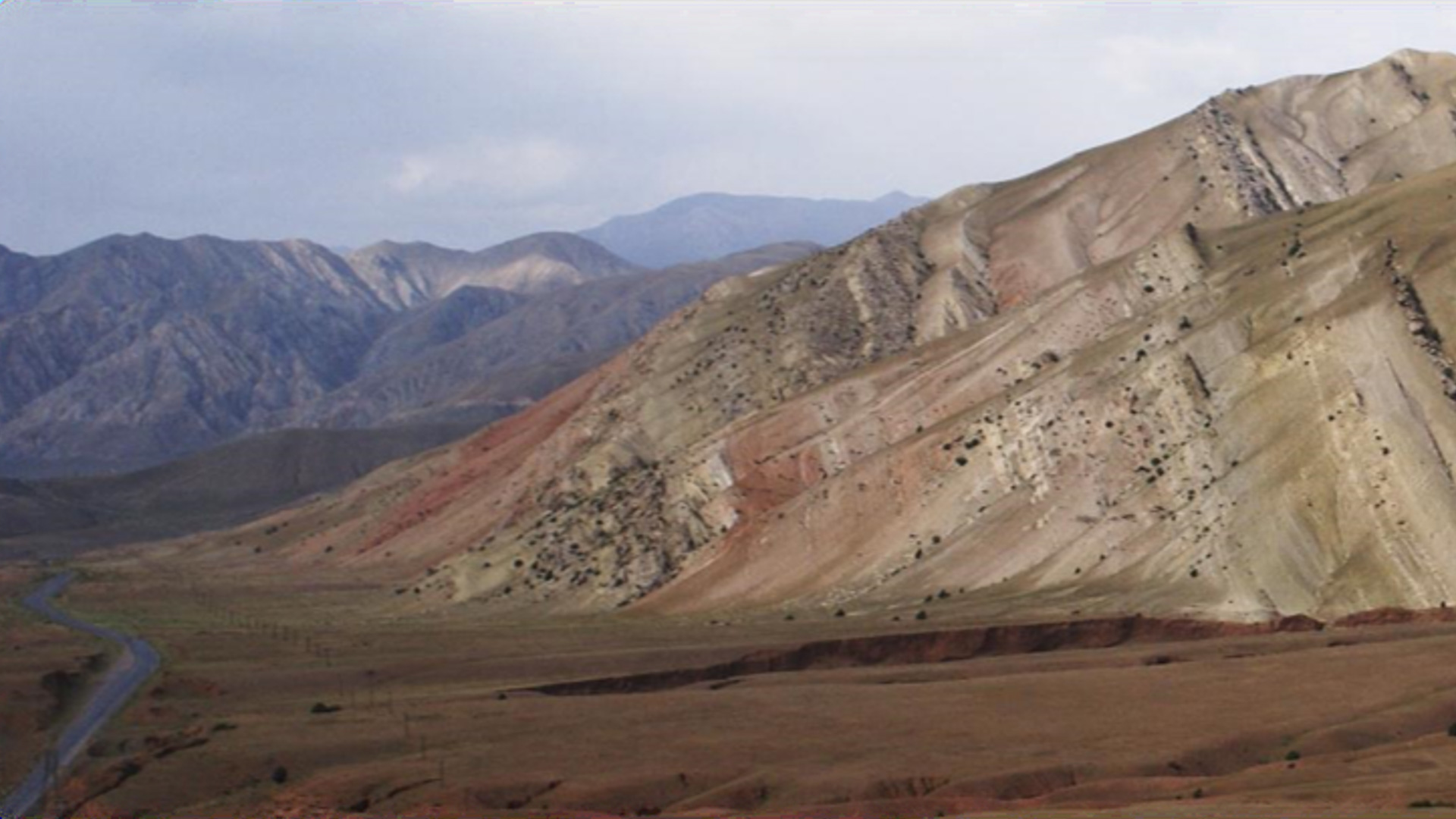 Tilted sedimentary strata in the Tian Shan, driven by the ongoing indentation of India into Asia. Credit: Stijn Glorie.