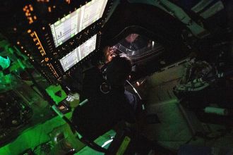 Astronaut Jeremy Hansen peers out the window of the Orion spacecraft