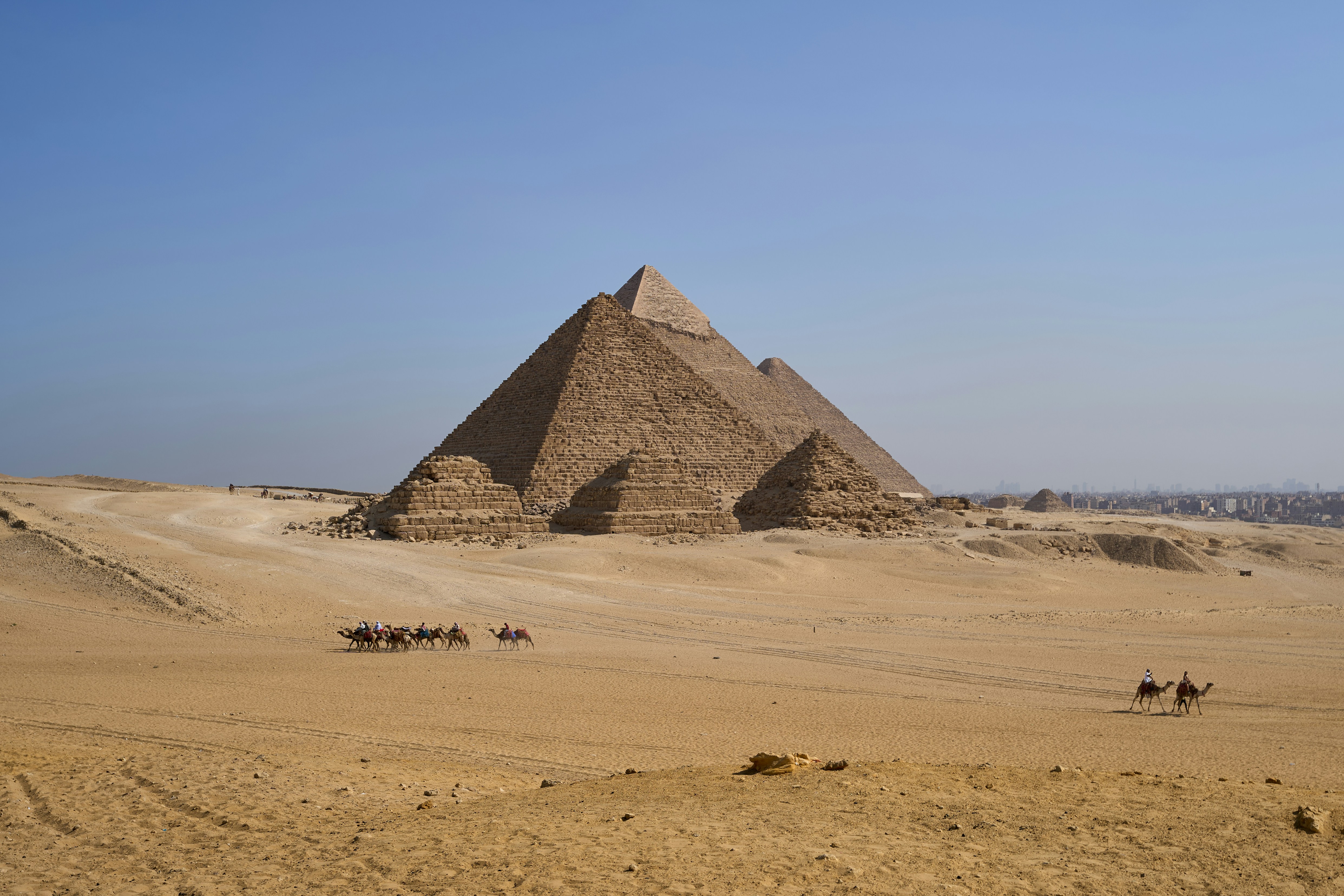Giza pyramid complex (Giza Necropolis) - the Pyramid of Khufu, the Pyramid of Khafre and the Pyramid of Menkaure. Photo by Dmitrii Zhodzishskii on Unsplash