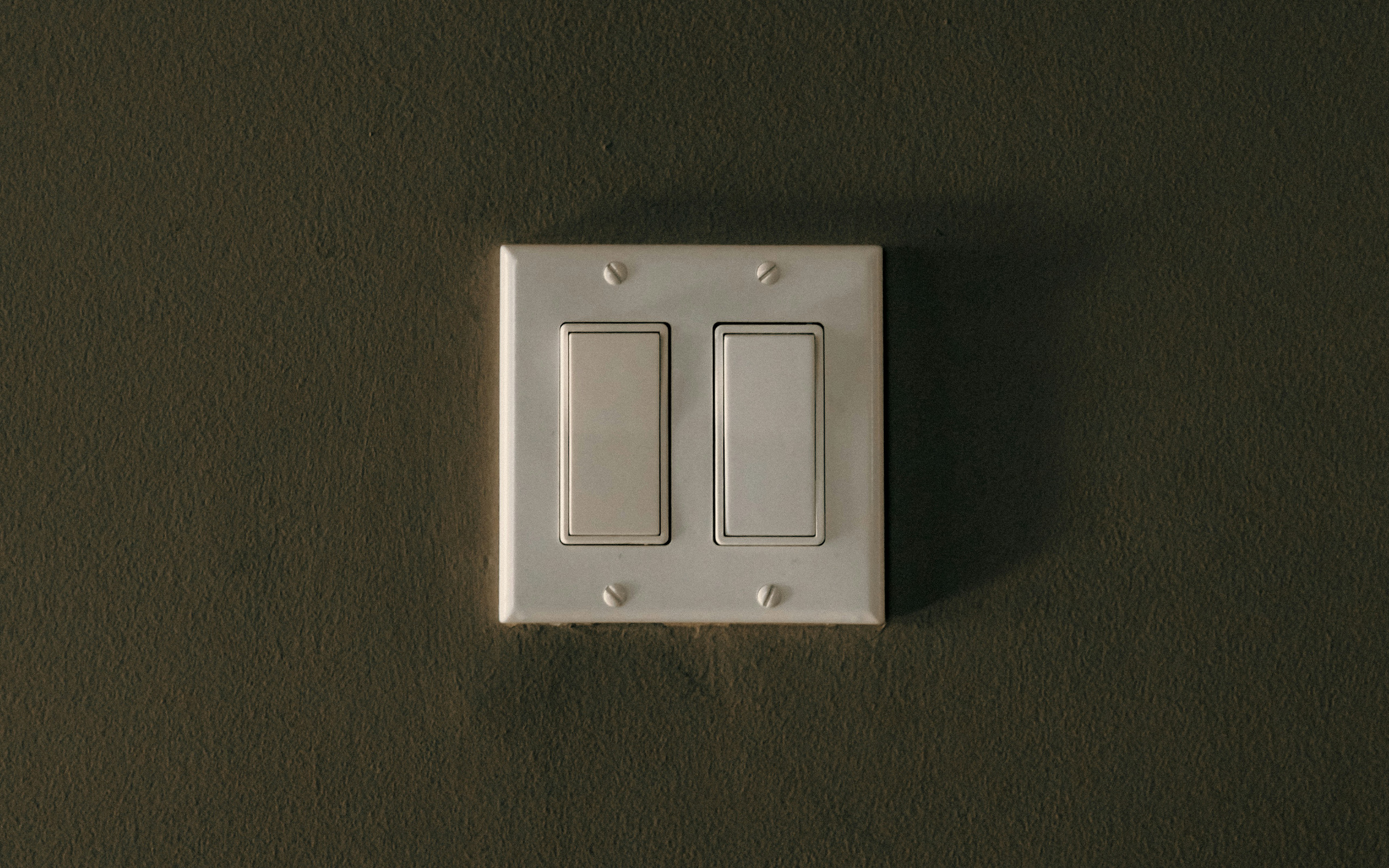 Light switch. Photo by Linus Belanger via Unsplash.