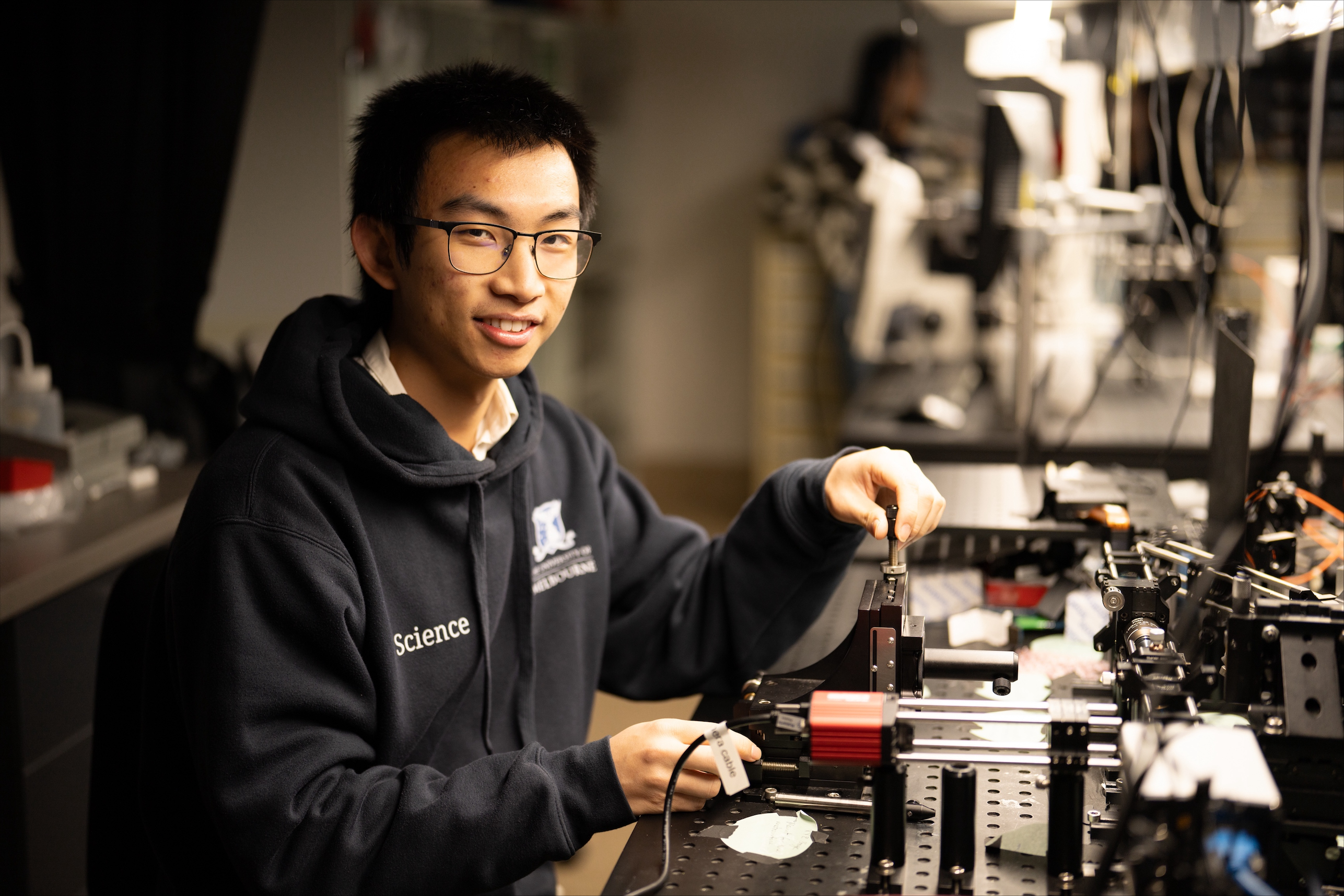 credit: Aman Chokshi/ description: Haiwei Wang in the lab.