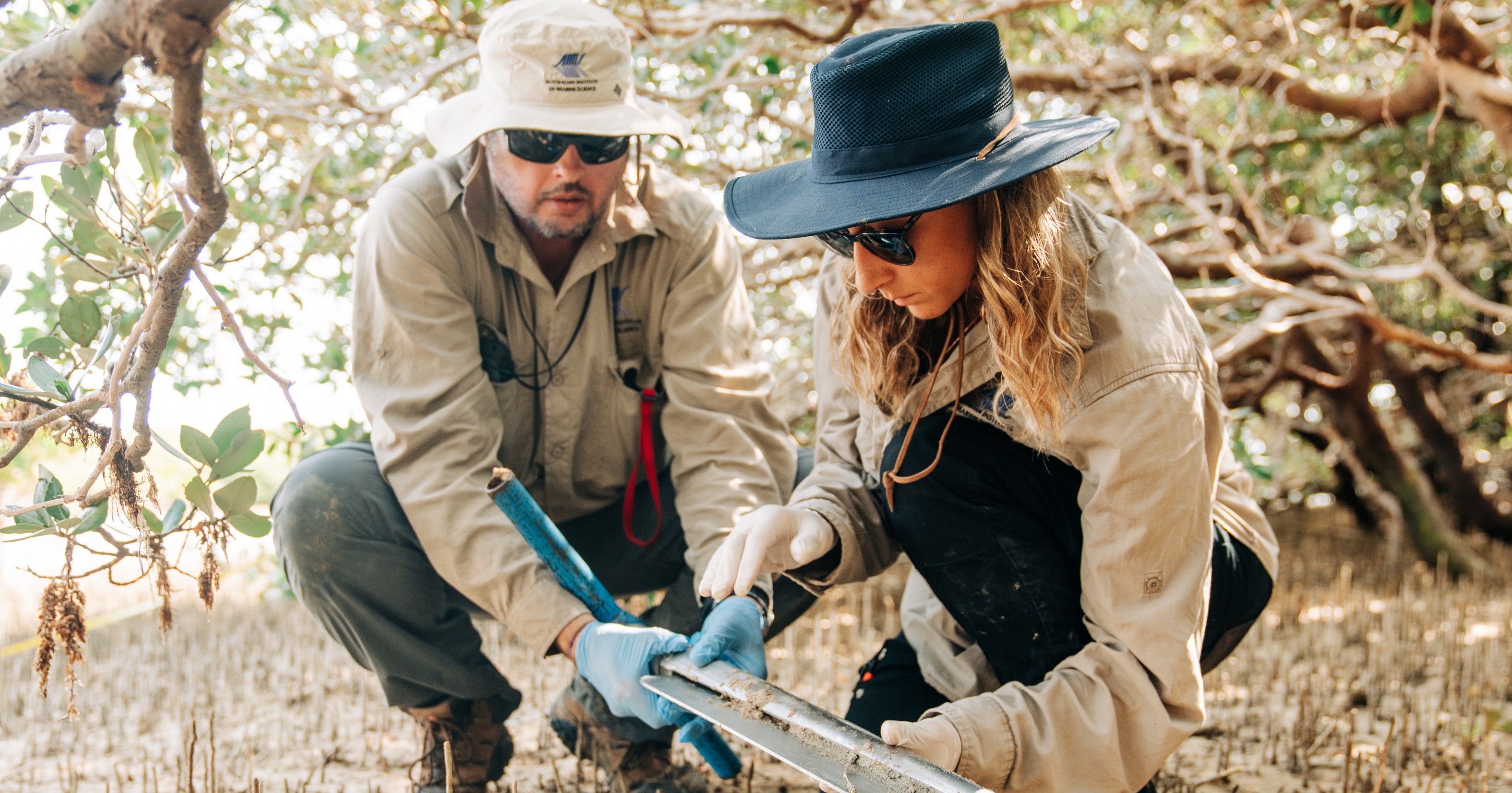 Dr Chris Fulton and Dr Kay Davis collecting a core sample using an auger at Mangrove Bay, near Exmouth. AIMS Photo by Violeta Jahnel Brosig.
