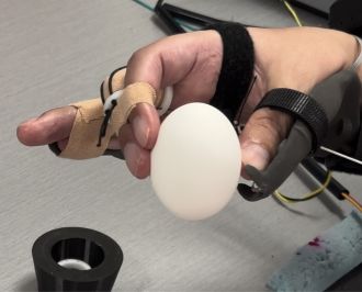 Keith Thomas demonstrates the grasp and lifting of empty eggshells