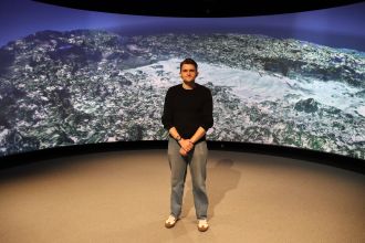 Dr Anthony Clarke in front of a 3D image of the Batavia wreck site.