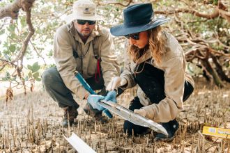 Dr Chris Fulton and Dr Kay Davis collecting a core sample