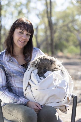 Dr Valentina Mella with a koala