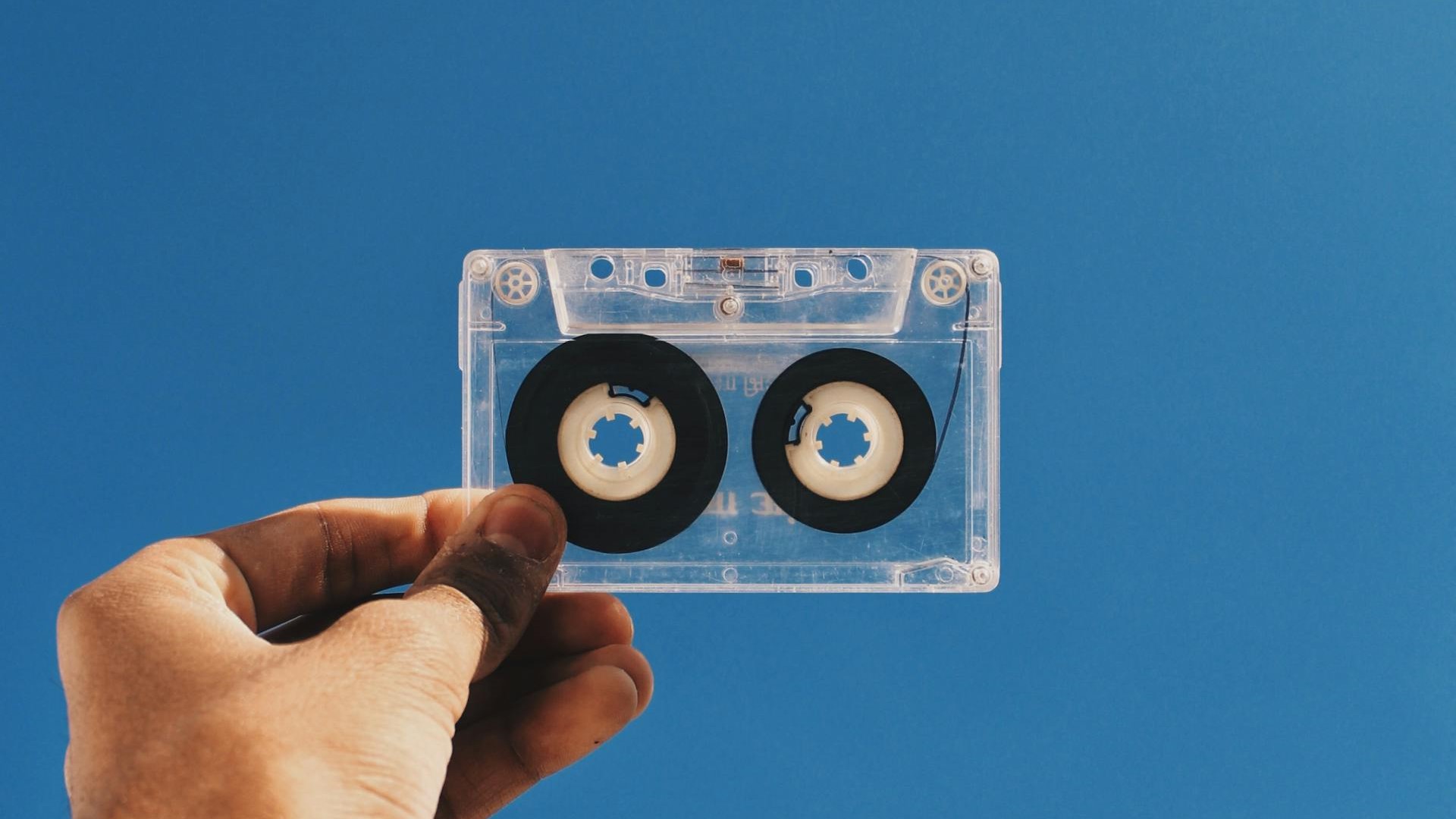 Photo by Swapnil Sharma: https://www.pexels.com/photo/clear-and-black-cassette-tape-on-person-s-hand-1760826/