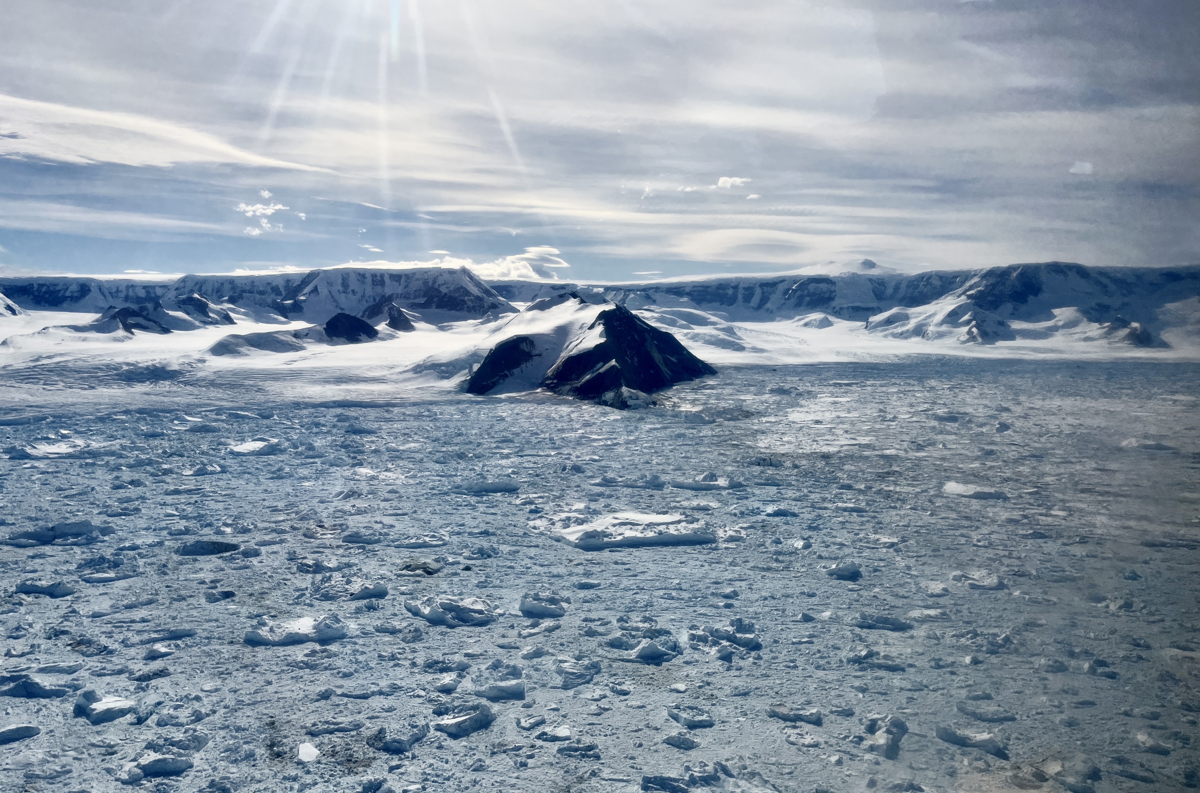 Hektoria (right) and Green (left) Glacier in February 2024 during field work in the Larsen B embayment. Remnanets of the glaciers fill the bay as ice bergs and melange. Credit: Naomi Ochwat