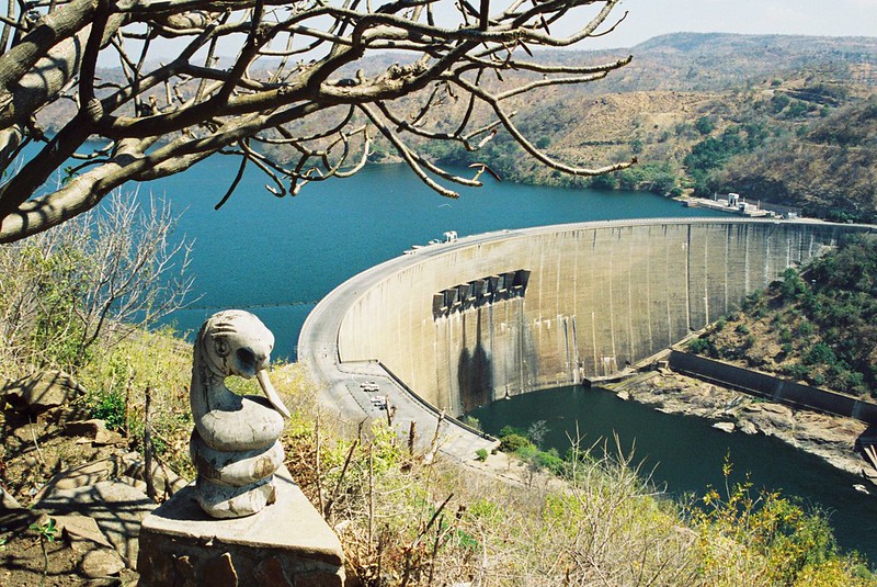 Kariba Dam, built on Zambezi River between Zimbabwe and Zambia in the 1950s, impounds the largest artificial reservoir in the world. Credit: Dave Cross CC BY-NC-SA.