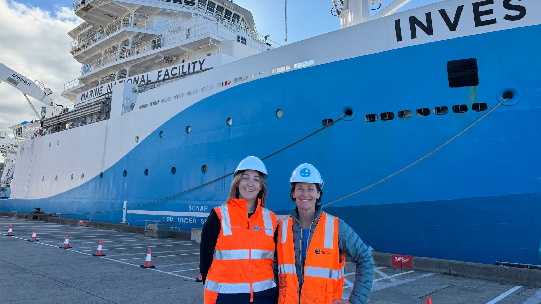 Voyage Manager Margot Hinds and Voyage Chief Scientist Associate Professor Rebecca Carey with the RV Investigator in Hobart. Image: Tyson Langer, CSIRO.