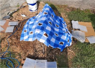 Frontal view of the incubator with blanket on