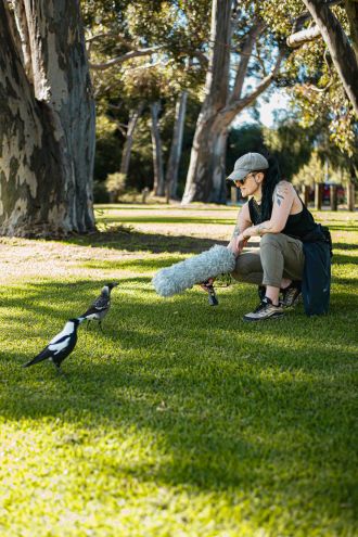 Dr Stephanie Mason with juvenile magpies 