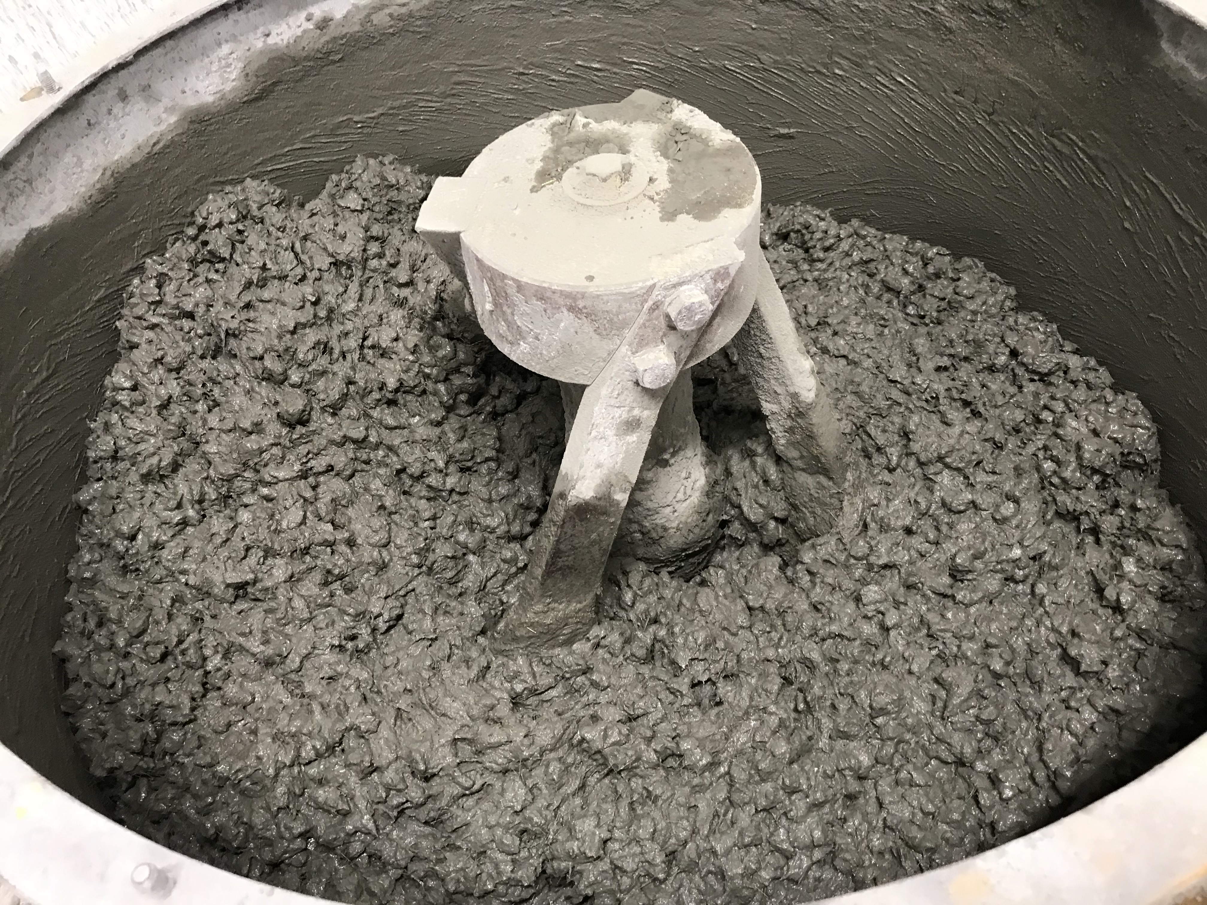 Concrete mixing using recycled tyre rubber particles for the complete replacement of traditional coarse aggregates. Credit: Mohammad Islam, RMIT