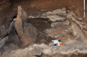 A 2,000 year-old standing stone, depicted during excavations