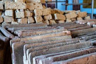 Neatly aligned ceramic roof tiles and tuff blocks 
