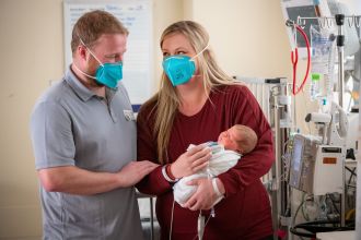 Jeff Maginnis and Michelle Johnson with Tobi in the UC Davis NICU