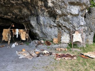 Reenactment scene in front of the Kesslerloch cave in Thayngen, Switzerland.