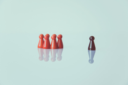 An image showing game pieces representing someone experiencing racial/ethnic discrimination. Markus Spiske, 2018, Free to use under the Unsplash license (https://unsplash.com/license)