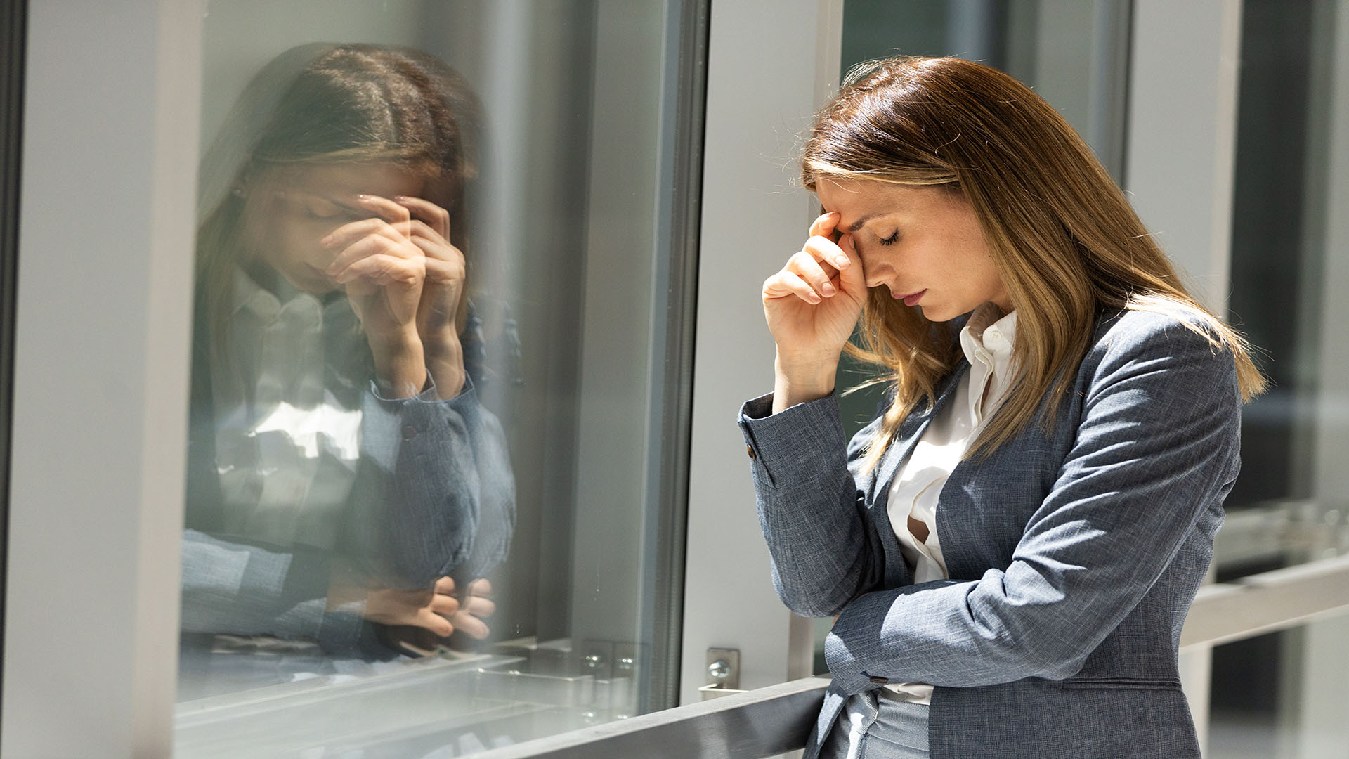 Getty images / female worker stressed at work