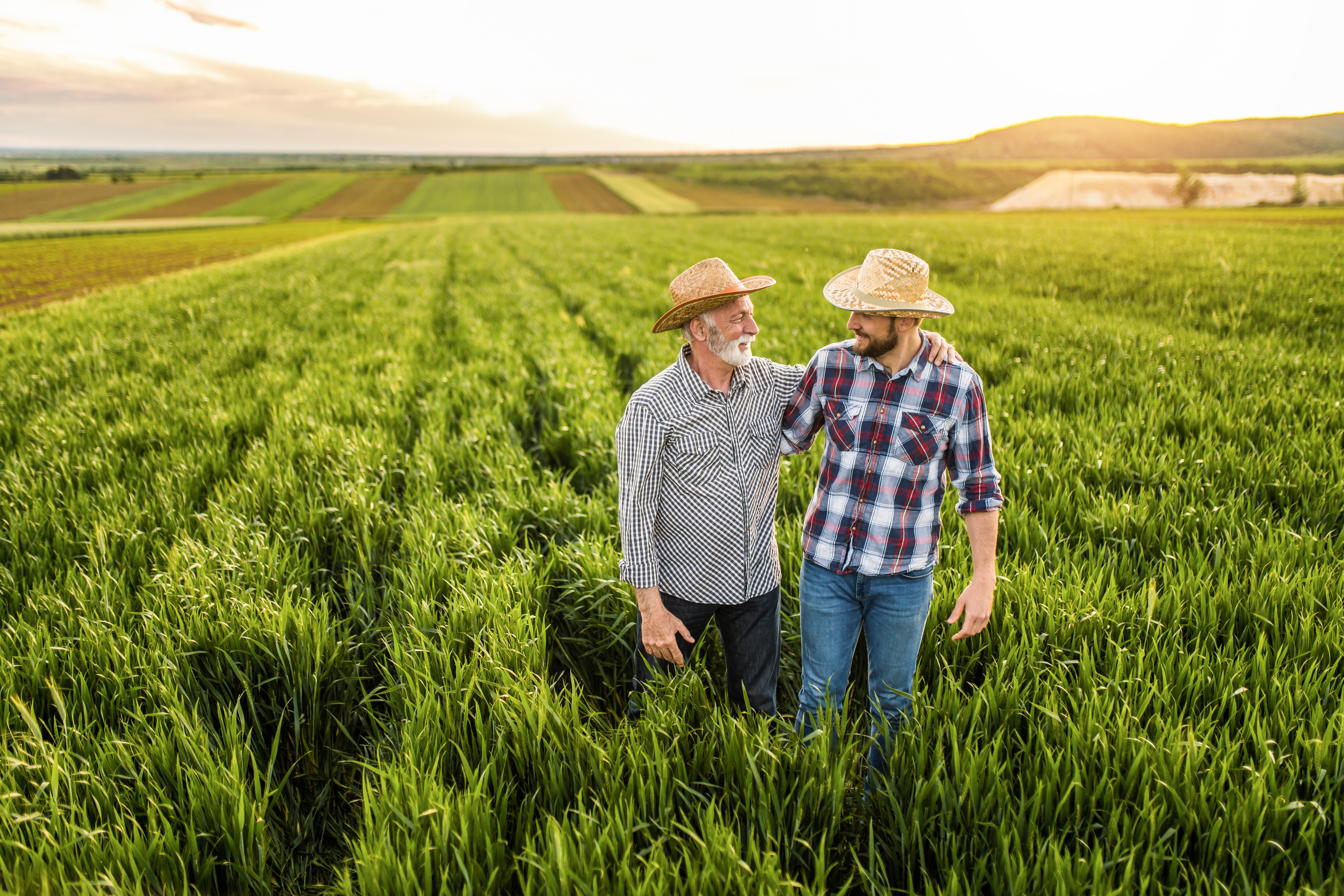 Getty images / farmers walking in field