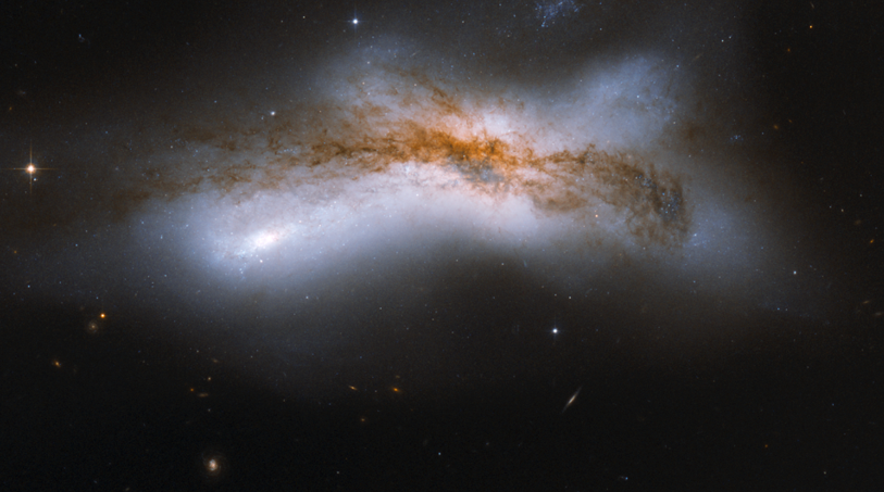 A 100,000 light-year separation leads to a collision. Credit: NASA / ESA