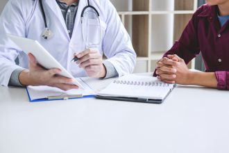 Doctor having consult with patient