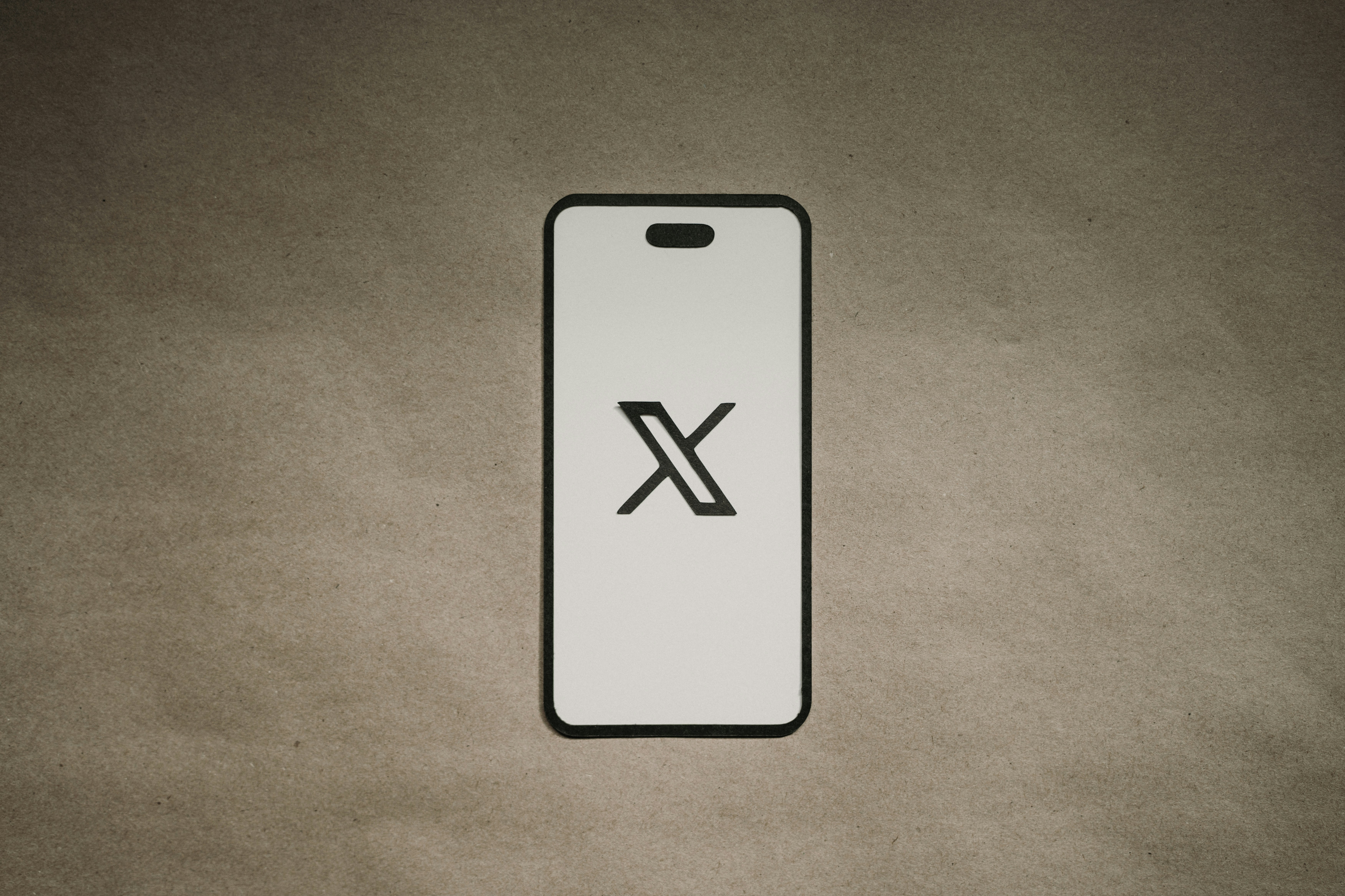 CC-0. https://unsplash.com/photos/a-phone-case-with-the-letter-x-on-it-8i8Xyo4jKp4