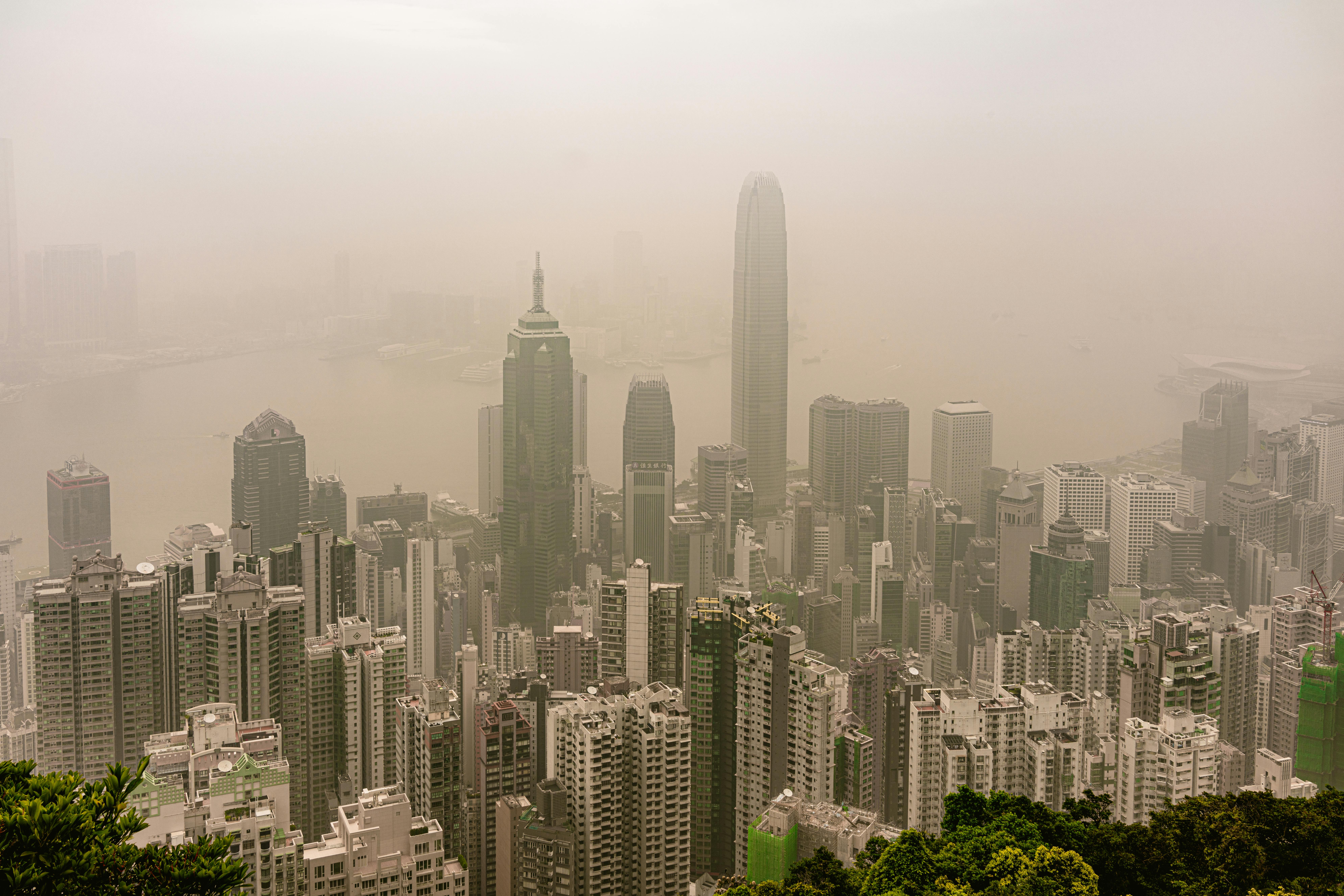 CC-0. https://www.pexels.com/photo/aerial-view-of-skyscrapers-in-downtown-hong-kong-covered-in-smog-16732096/