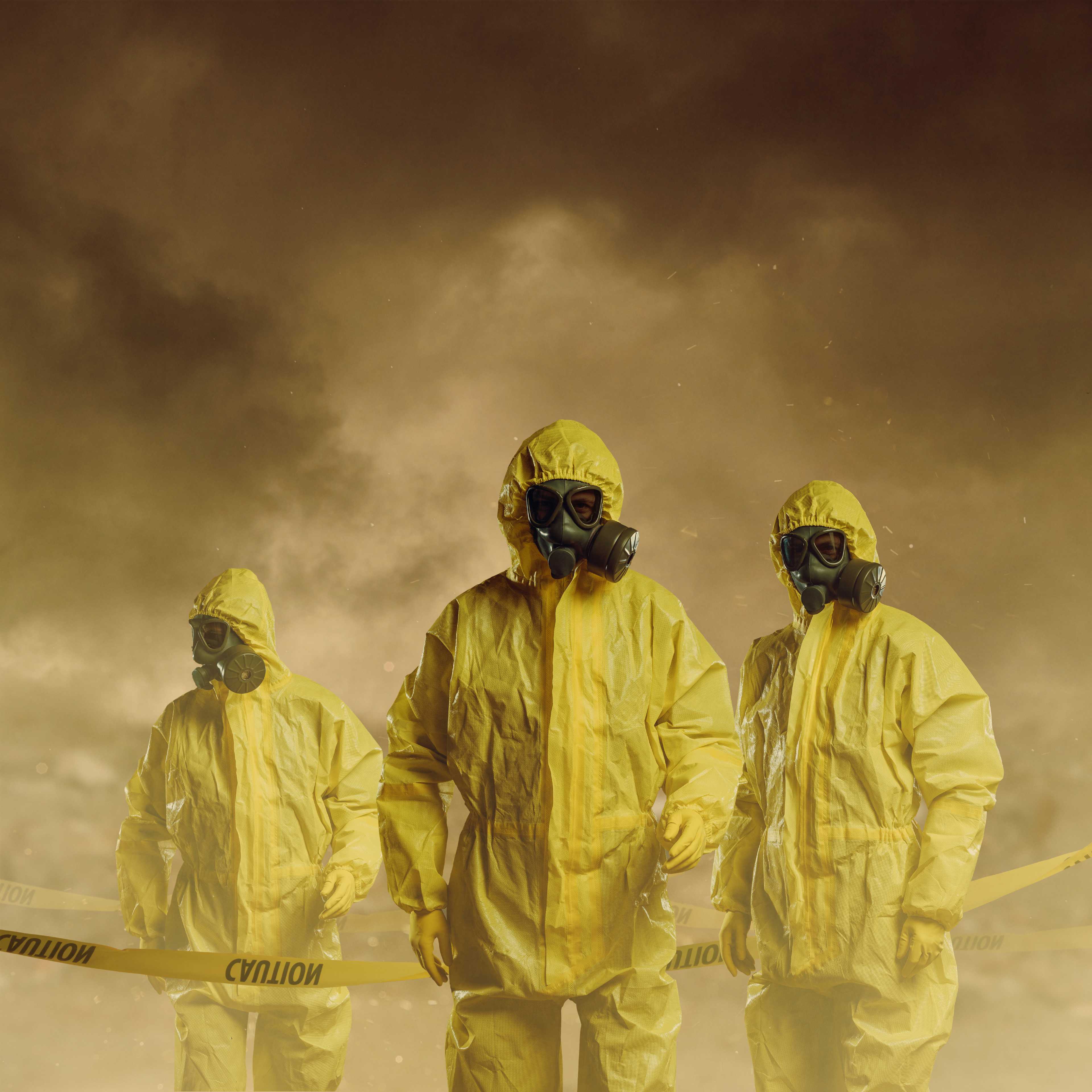 People wearing protective suits as part of biosecurity. iStock image by D Keine.