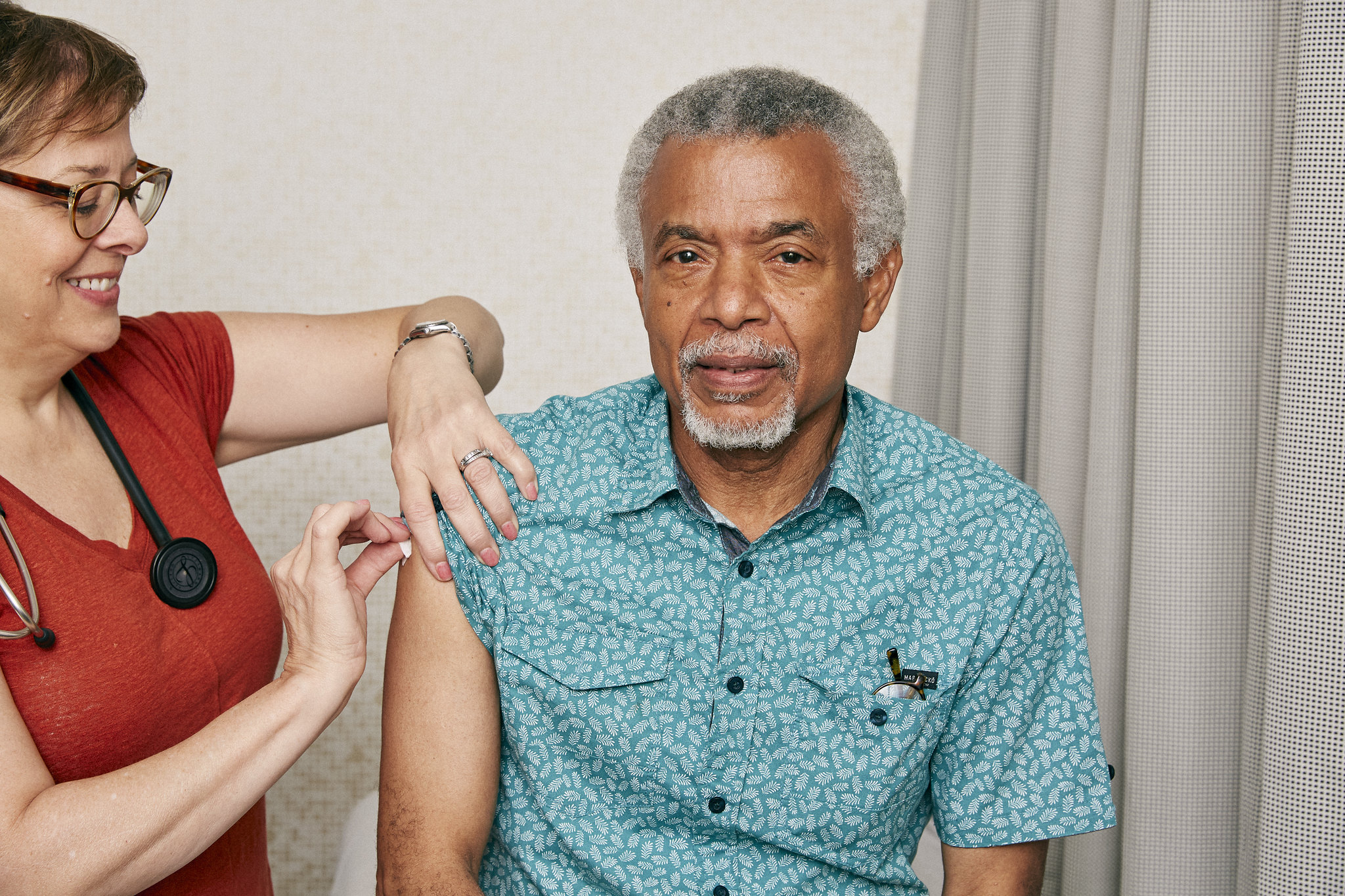 CC:BY-2.0 Older man having his upper arm cleaned before a shot Photographer: Heather Hazzan; Wardrobe: Ronald Burton; Props: Campbell Pearson; Hair: Hide Suzuki; Makeup: Deanna Melluso at See Management. Shot on location at One Medical. https://www.flickr.com/photos/selfmagazine/48545847181/in/album-72157710332198661/