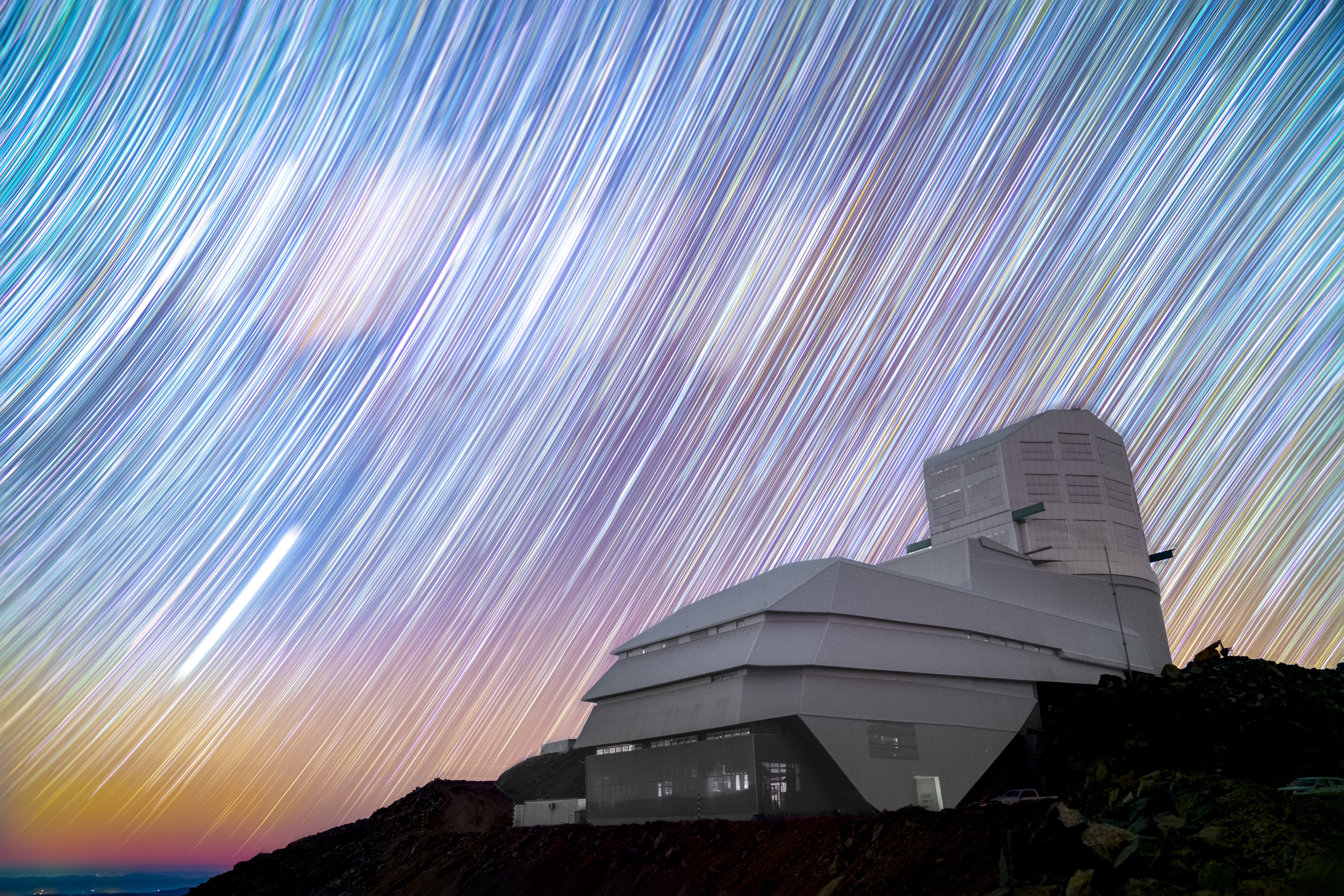 Vera C. Rubin Observatory beneath star trails. Credit: Hernan Stockebrand