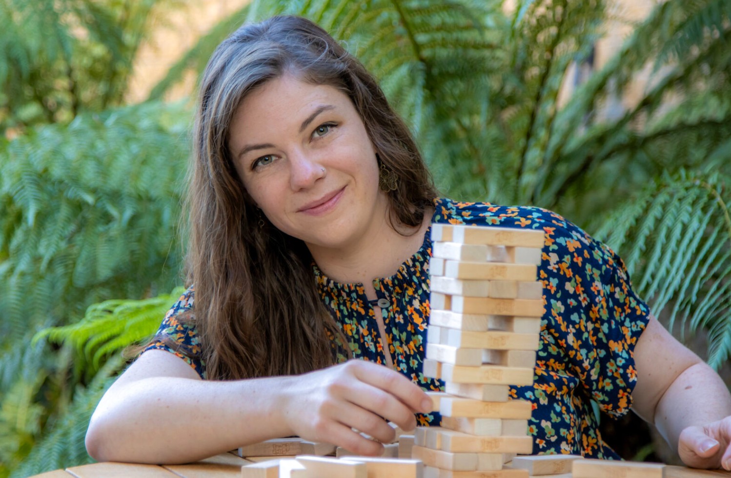 Dr Quinn explains how a Jenga tower represents a fragile ecosystem state, where both external factors and human choices can affect the overall resilience of the tower. Image: Peter Allen, UTAS. 
