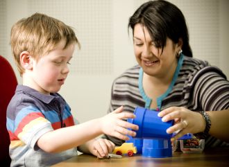 Associate Professor Josie Barbaro with Jaidyn, who was identified via SACS-R.