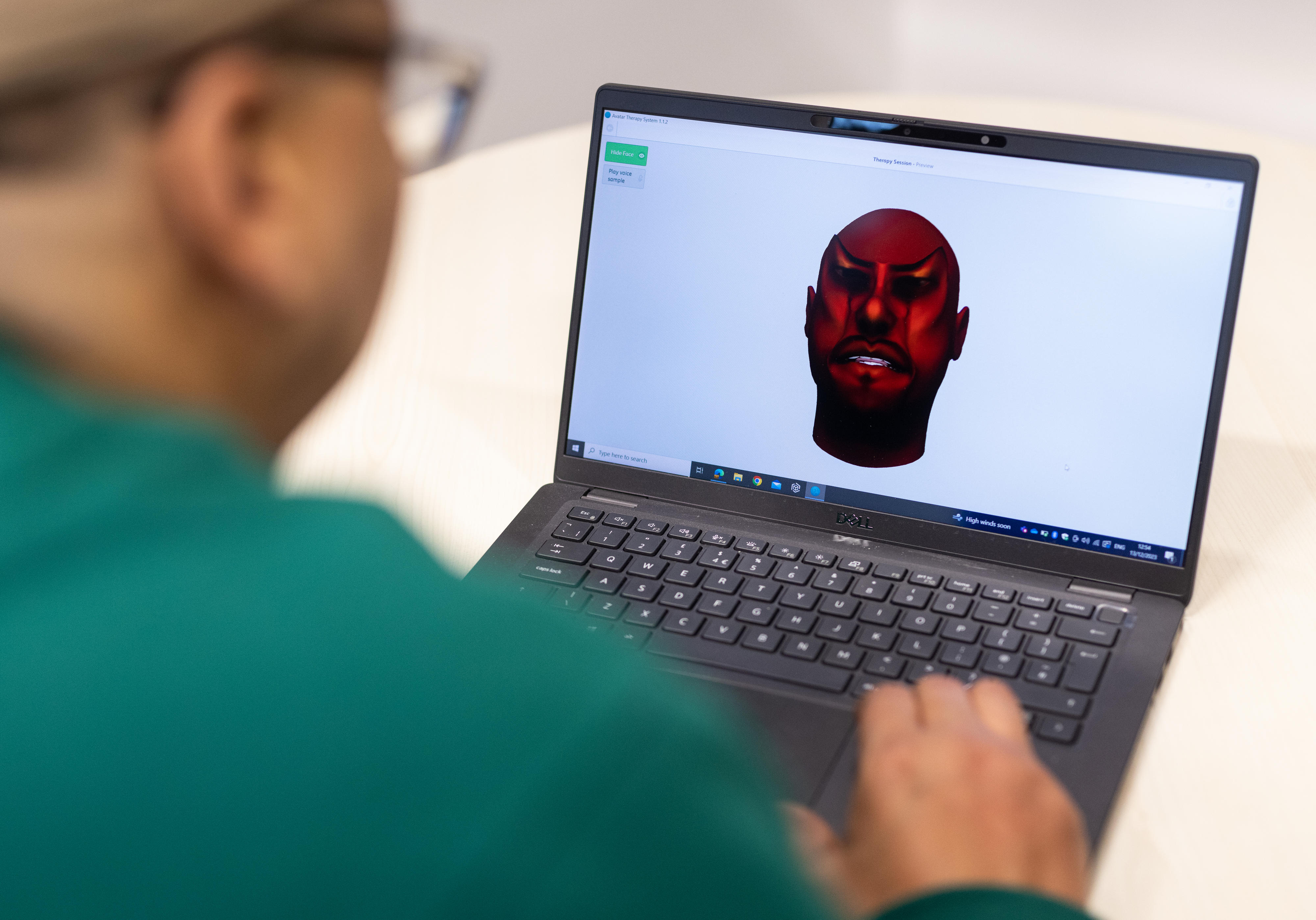 Natalie, a Patient and Public Involvement (PPI) Consultant who received AVATAR therapy, spoke face-to-face with the avatar in each session, practicing standing up to it. The therapist spoke with Natalie remotely, talking as themselves as well as voicing the avatar using voice conversion software. This image is intended for illustrative purposes only and does not depict an actual therapy session. Credit: Chris Ratcliffe. Commissioned by Wellcome.