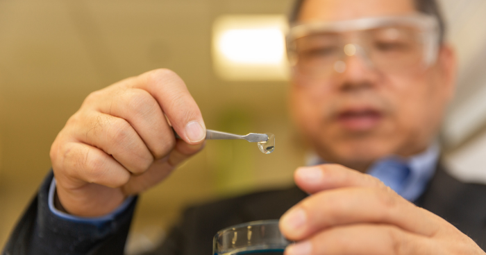 University of Melbourne Professor Greg Qiao, a BIENCO Chief Investigator, inspects a transparent hydrogel scaffold. Photo credit: Cesar Nicolas