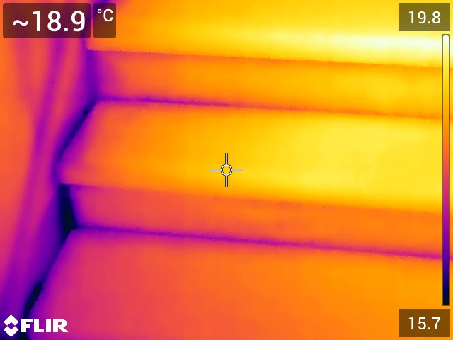 Infrared image of a staircase, that shows where cold air is seeping through..