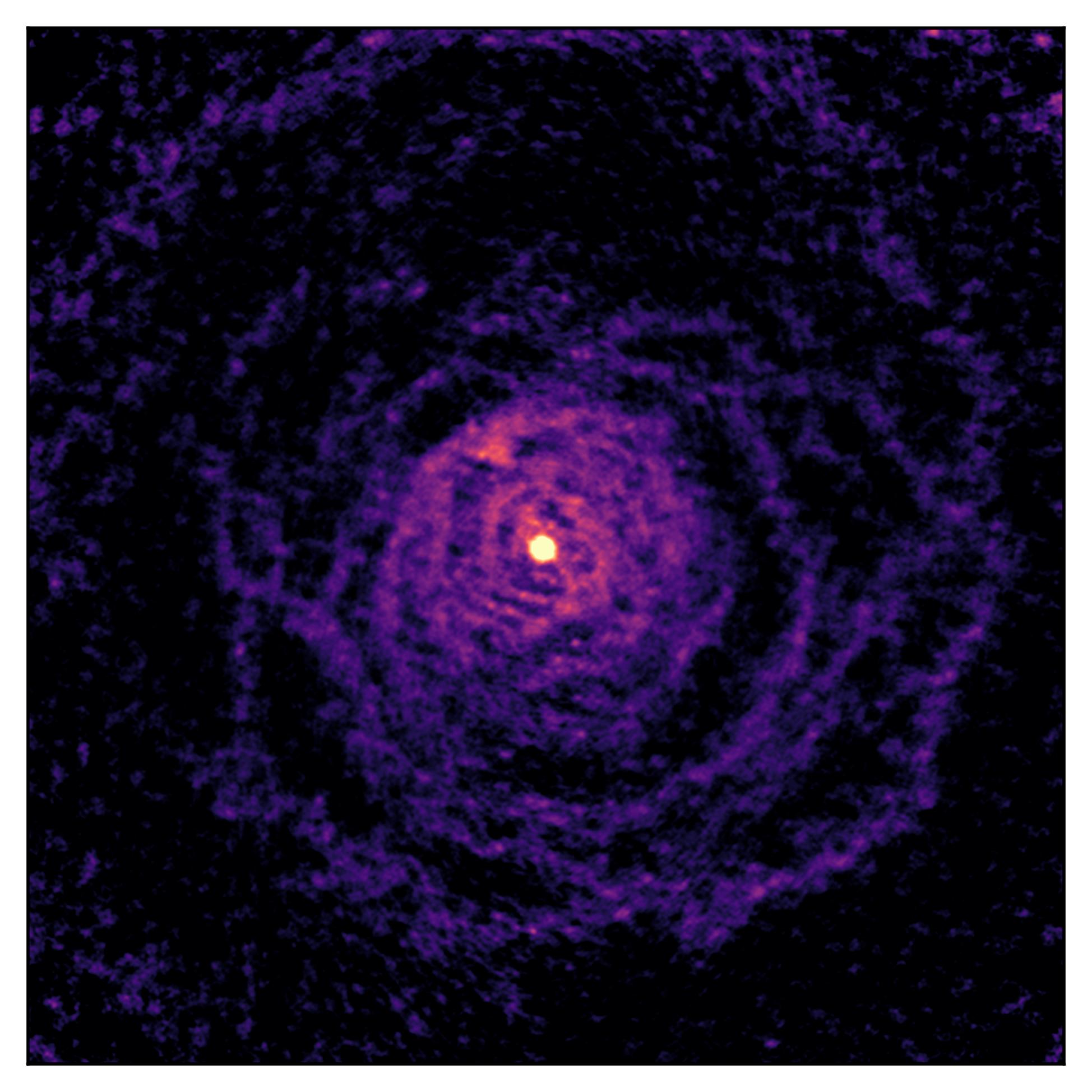 Caption: The ALMA telescope shows how the gas around the dying star in W Aquilae has been shaped by interactions with a sun-like companion star. Both stars are located in the bright central region of this image.  Credit: ALMA