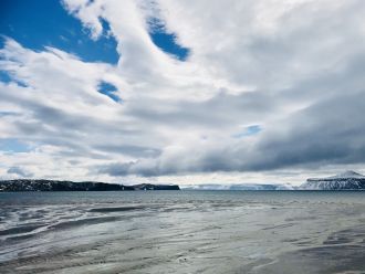 Low clouds over the coastline of the Antarctic Peninsula and surrounding islands