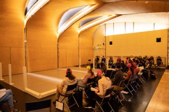 Participants in front of stage