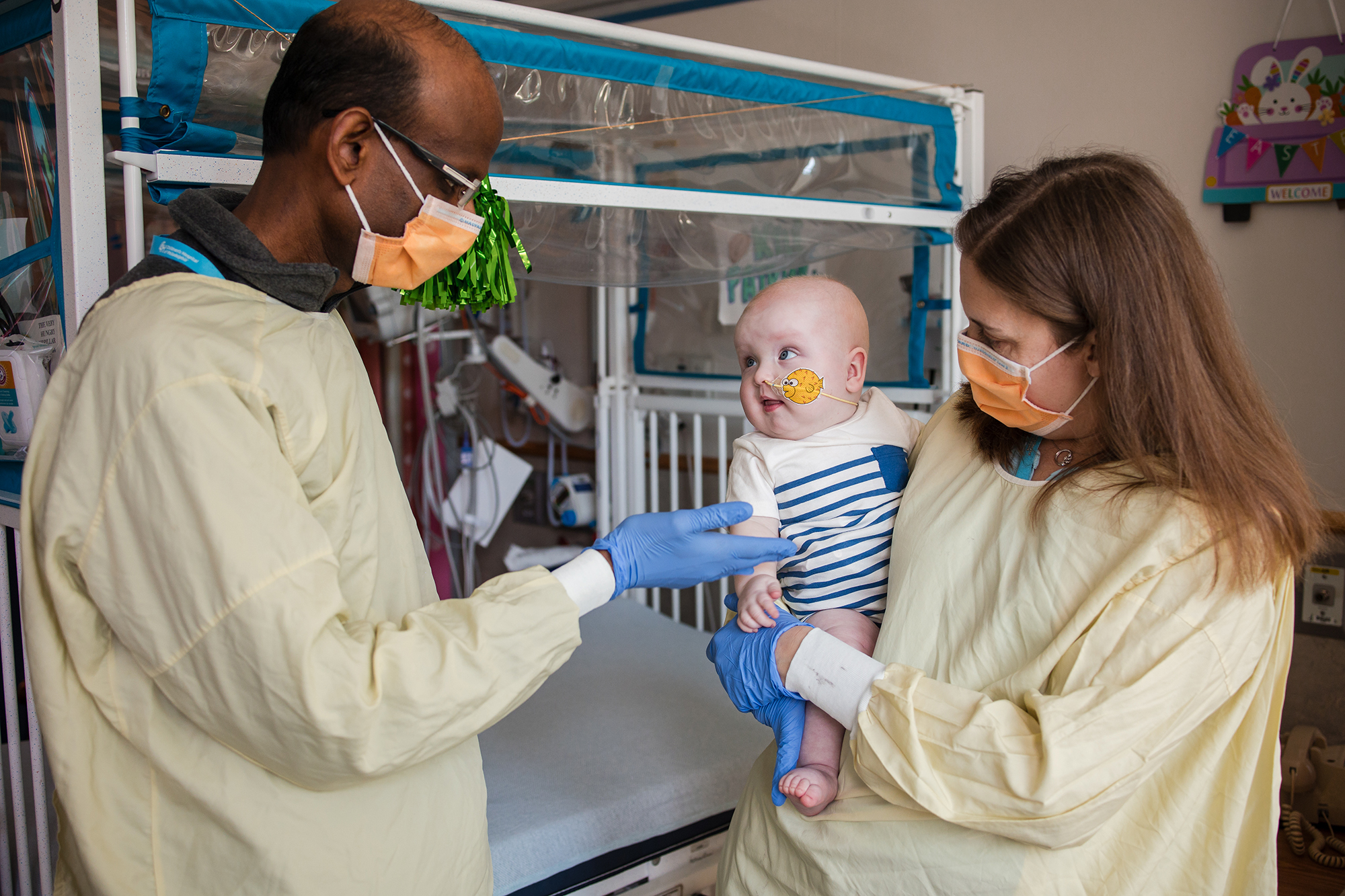  Penn Medicine’s Kiran Musunuru and Rebecca Ahrens-Nicklas holding KJ post infusion. Credit: Children's Hospital of Philadelphia