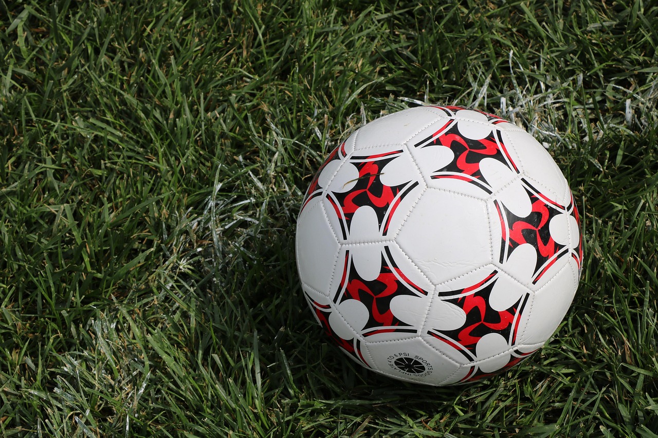 CC-0. https://pixabay.com/photos/football-ball-field-sport-grass-8266065/