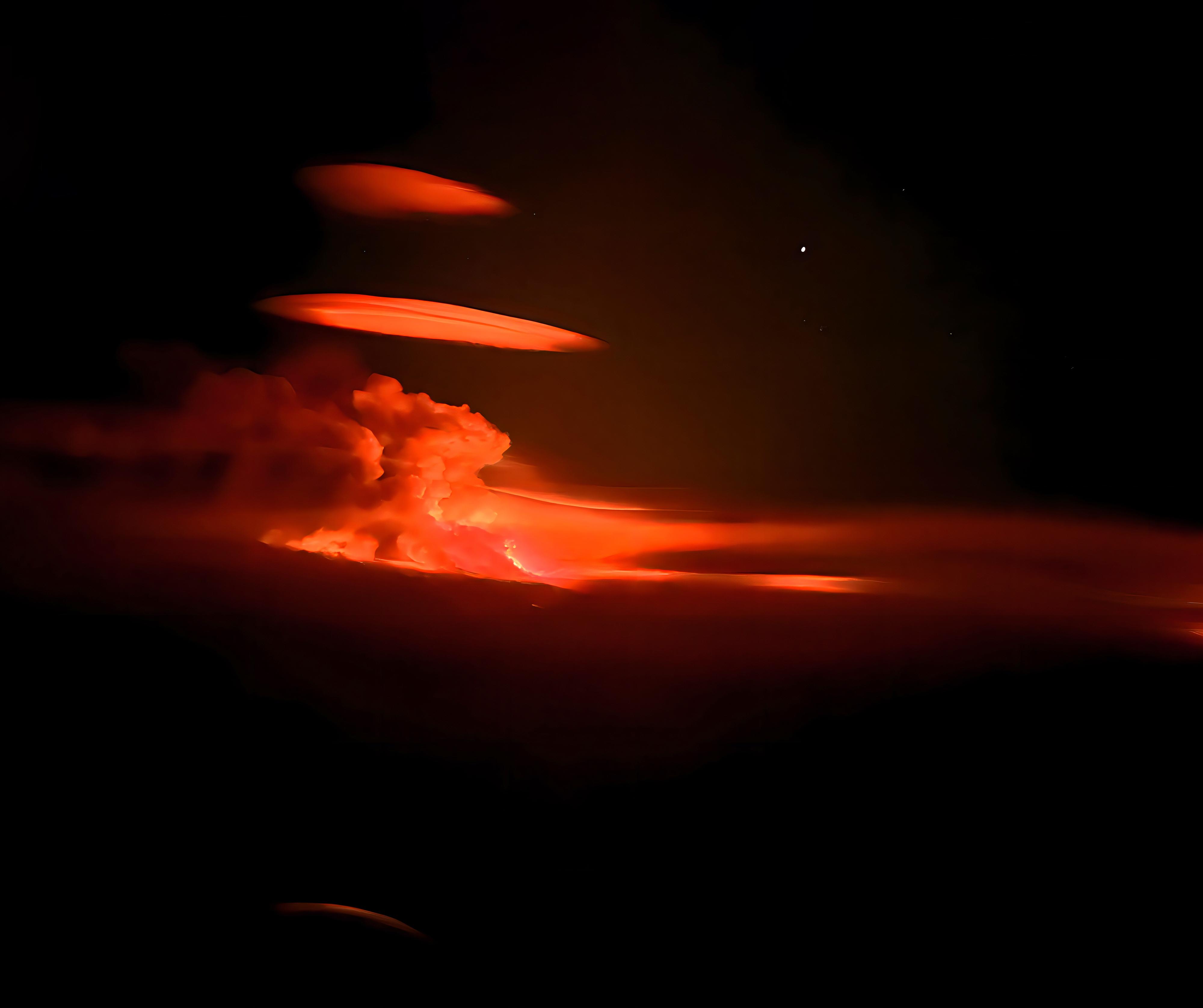 : The photo shows two stacked clouds illuminated by the glow of an overnight firestorm at Adams Lake, British Columbia, in August 2023, during a record-breaking fire season in Canada. Credit: Amir Paz; apaz@verimap.com.
