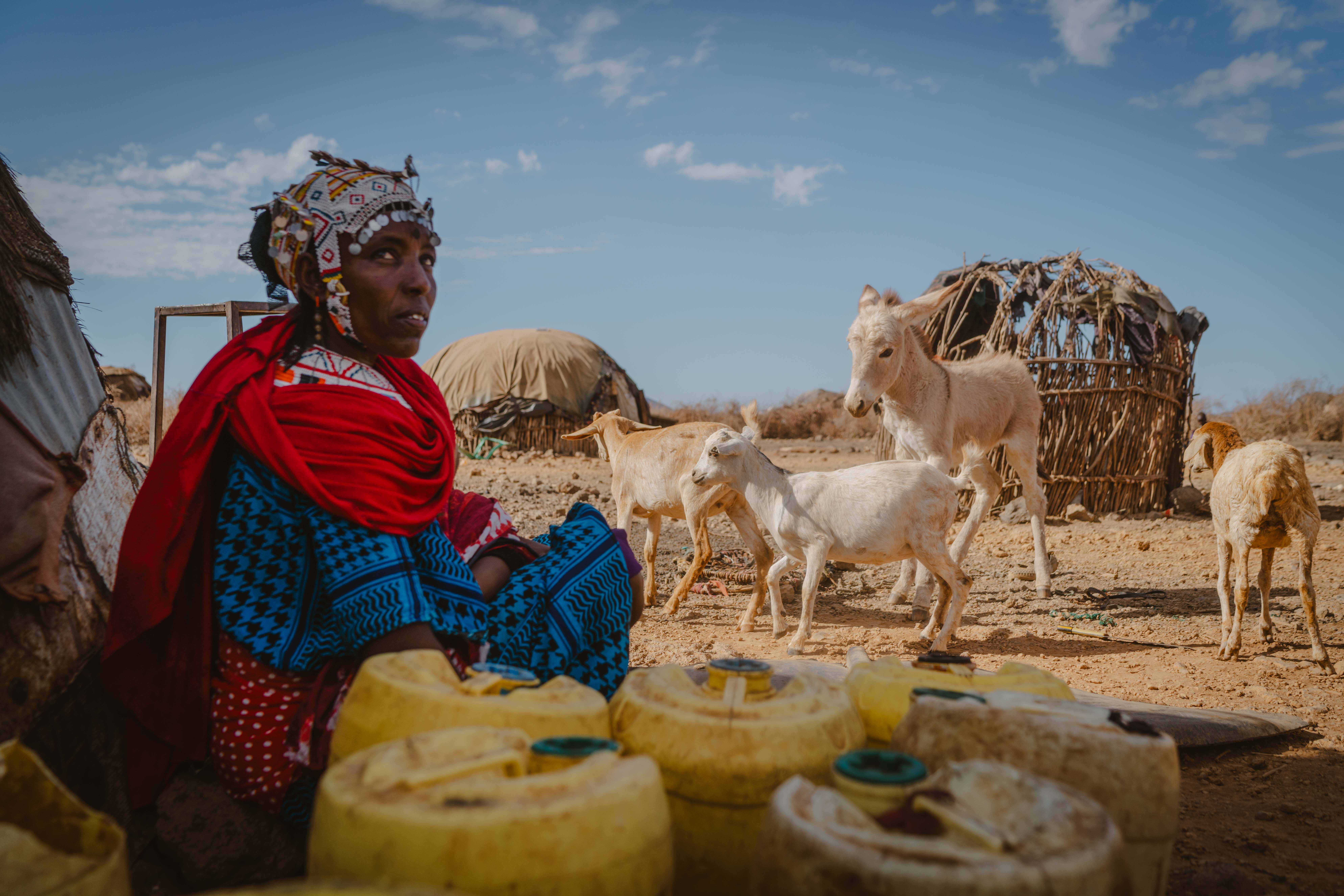 Image Caption: Dukano Kelle collecting her jerry cans to fetch water in Kambinye Kenya on the 15th of October 2024   Image Credit: Fredrik Lerneryd/Oxfam, CC-BY 4.0 (https://creativecommons.org/licenses/by/4.0/)