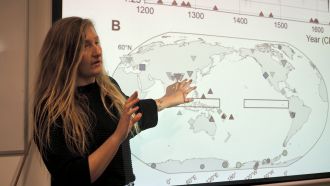 Dr Georgy Falster close up presenting findings