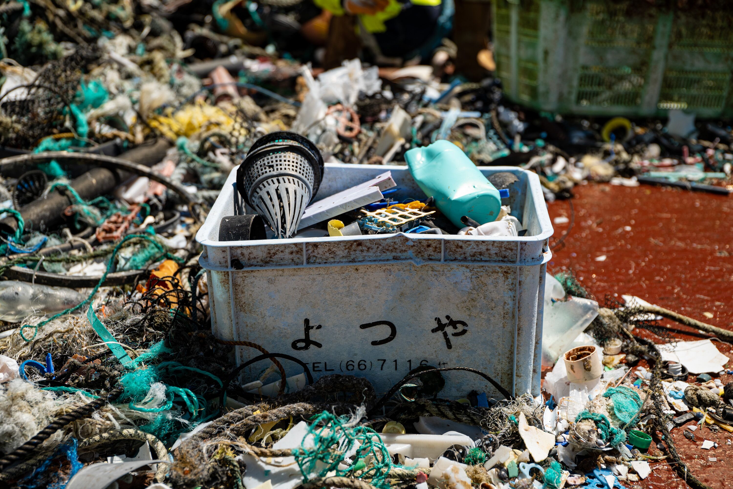 Samples of plastic caught in the Great Pacific Garbage Patch by System 002, the most recent iteration of our ocean cleaning system: a crate (with visible Japanese text), eel traps and nets are all visible, all of which originate from fishing activities. Credit: The Ocean Cleanup