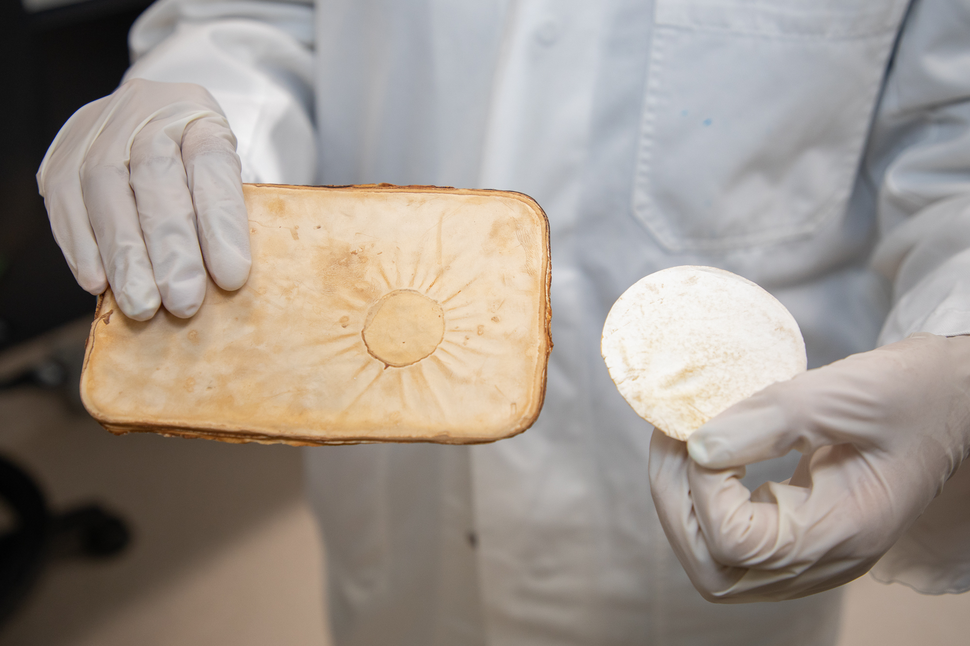 PhD researcher and lead author Nattanan (Becky) Chulikavit holding the compressed mycelium sheets