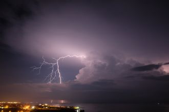 Tropical thunderstorm with lightning, near the airport of Santa Marta, Colombia