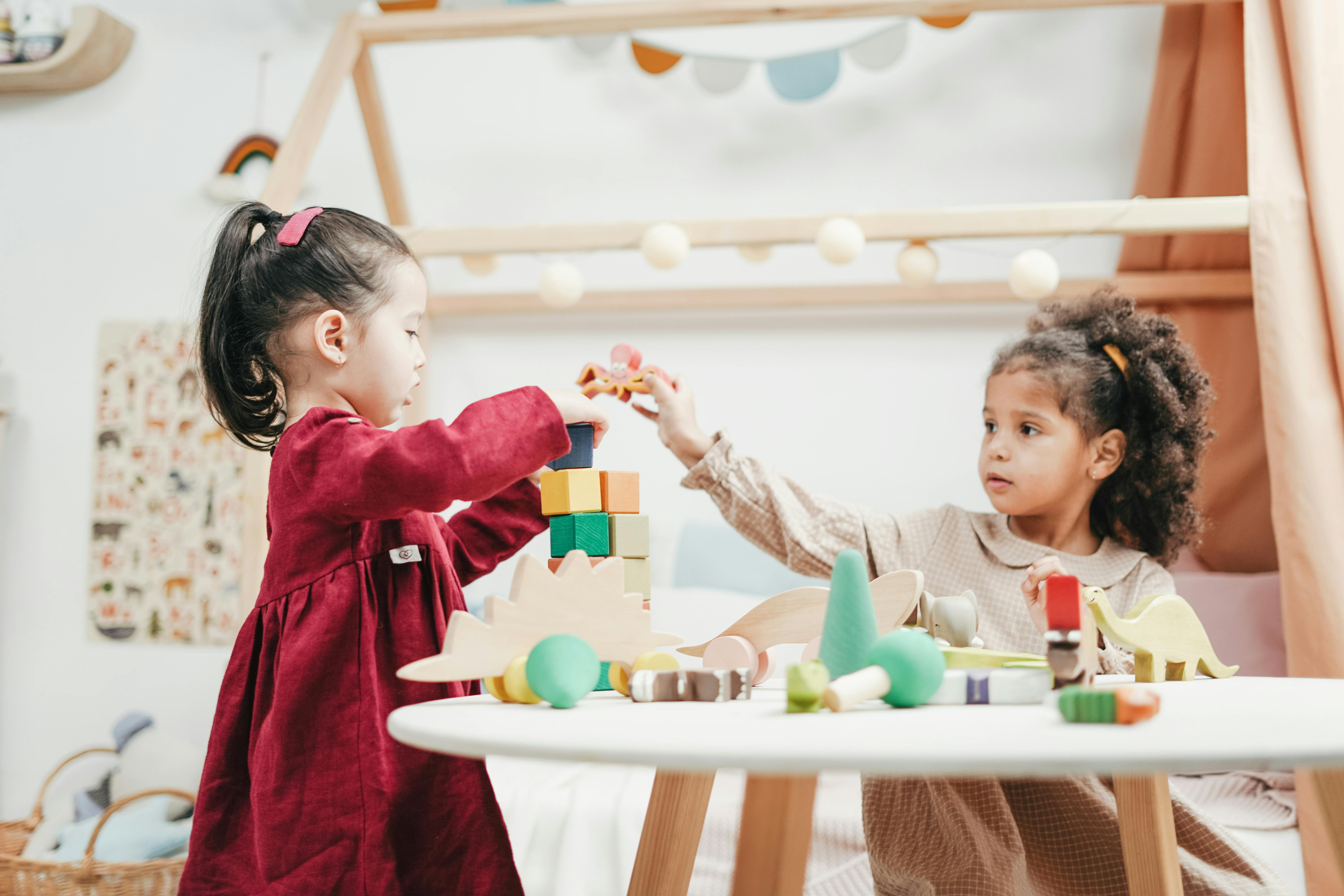 Photo by cottonbro studio: https://www.pexels.com/photo/girl-in-red-dress-playing-a-wooden-blocks-3662667/